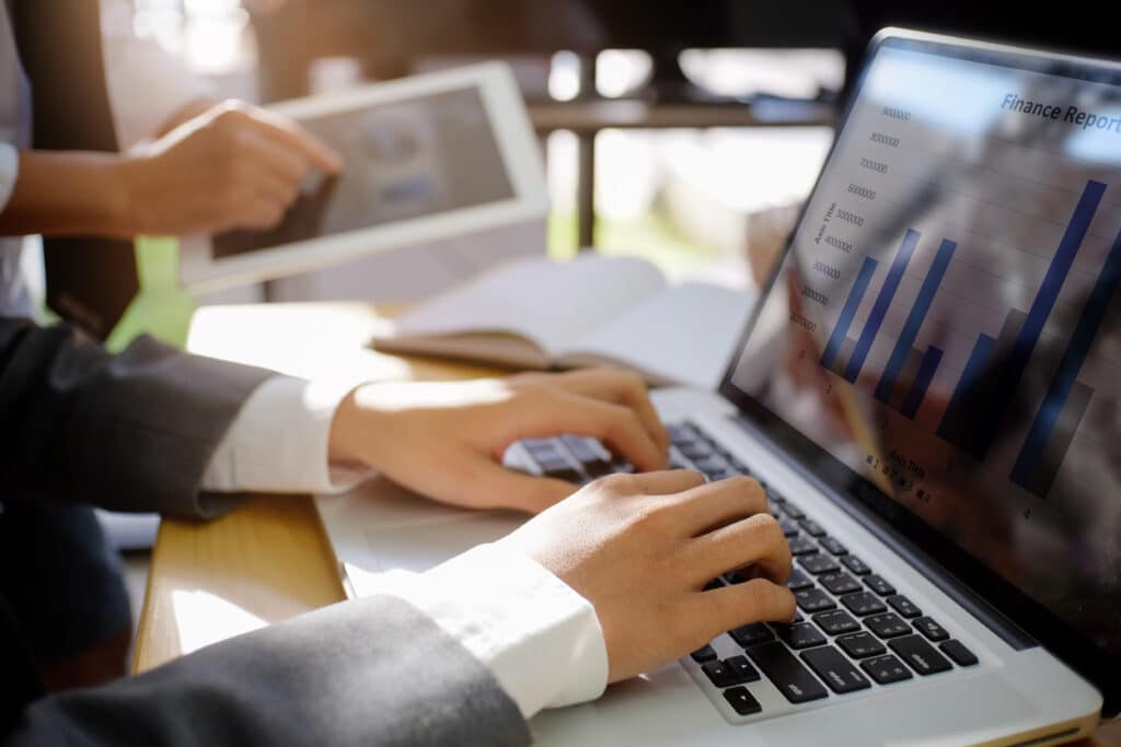 Business man using laptop computer for a analysis financial data